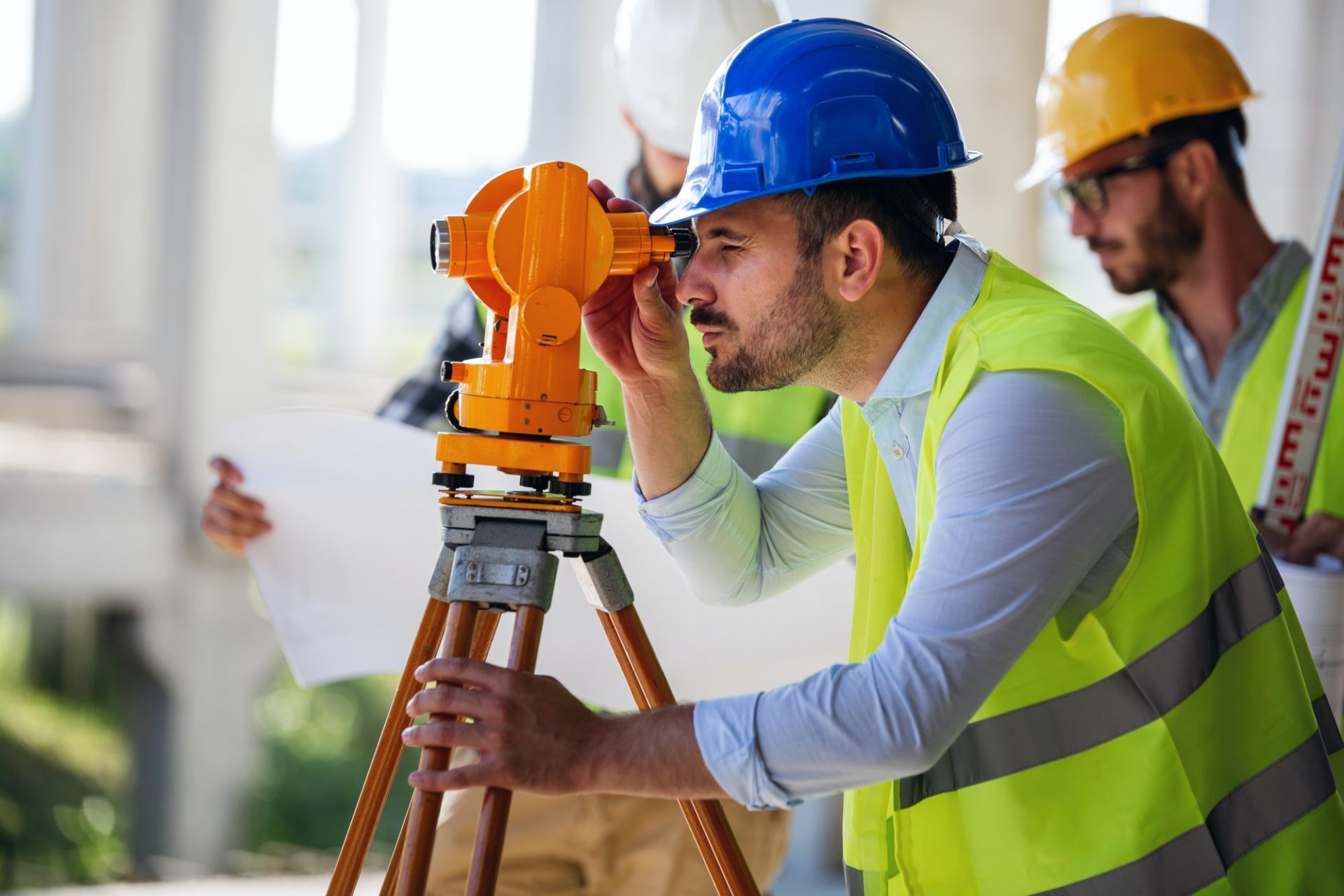 engineer-surveyor-working-with-theodolite-at-construction-site-1-e1648614580516